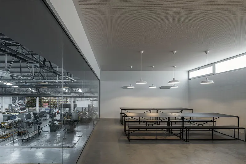 Monolithic kitchen unit anchors the industrial interior design