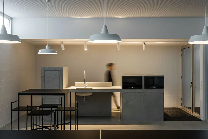 Elevated dining area overlooking active industrial workspace