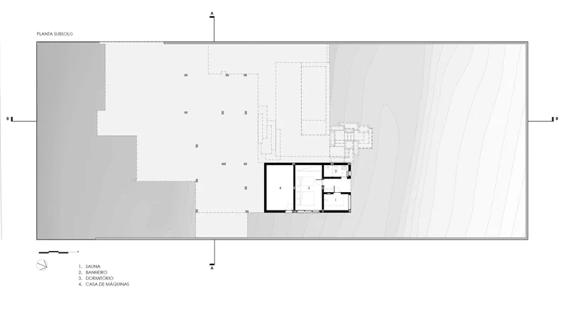 Basement floor plan drawing showing service spaces and a small suite in the corner of the lot