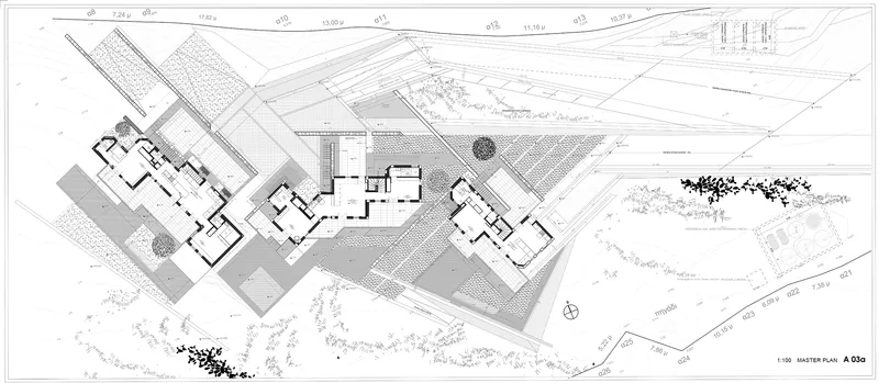 Site plan drawing showing three residential volumes arranged along a sloping terrain with landscaping