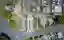 This aerial photograph showcases a meticulously planned cemetery with a geometric layout. The design