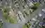 This aerial photograph showcases a meticulously organized cemetery, characterized by rows of tombsto