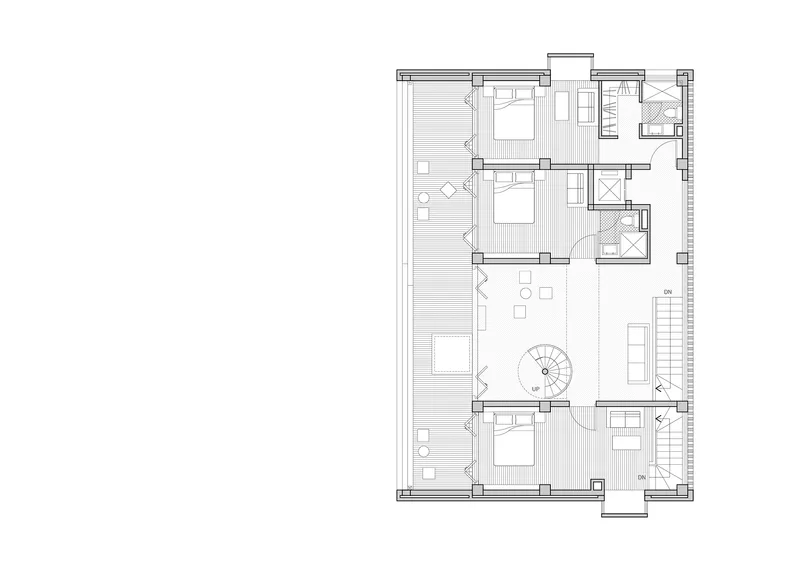 Floor plan showing bedroom arrangement around a central spiral staircase with exterior terrace access