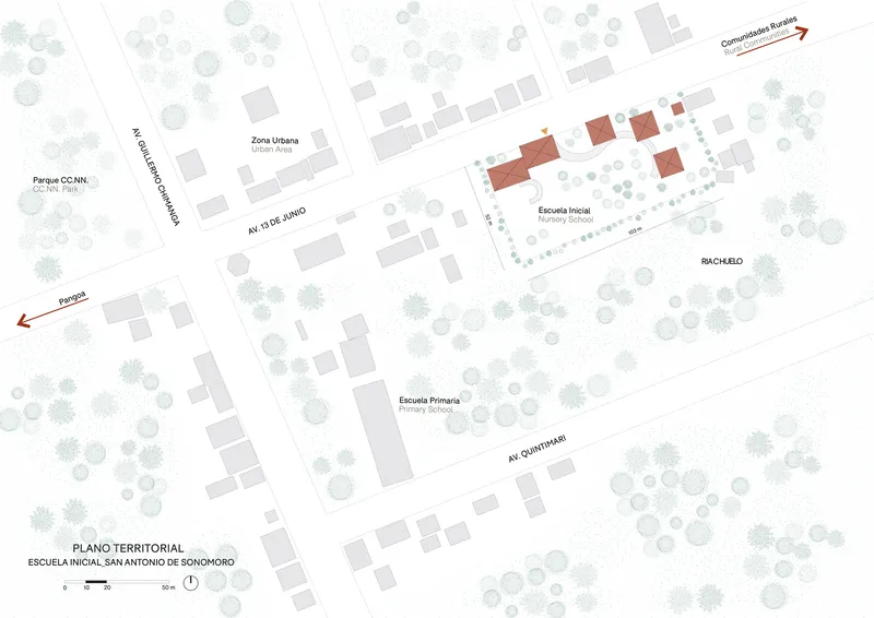 Site plan drawing showing red building clusters among trees along two intersecting avenues