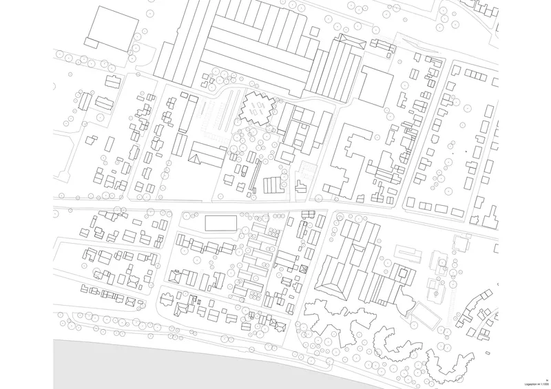 Site plan drawing showing cluster of elongated buildings and curved structure amid surrounding urban fabric