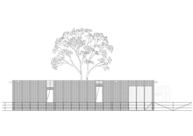 Elevation drawing depicting the brick facade with angular window openings and a tree above the roofline