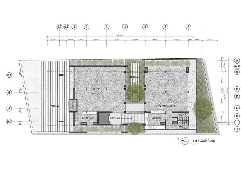 First floor plan showing studio and recreation areas separated by a central lift hall and courtyard