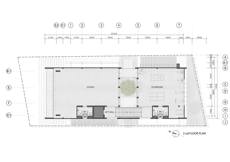 Second floor plan showing studio and playroom flanking a central courtyard with stairs