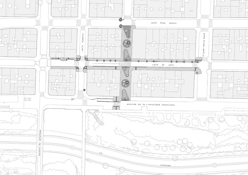 Site plan drawing showing street intersection with circular planting elements and building footprints