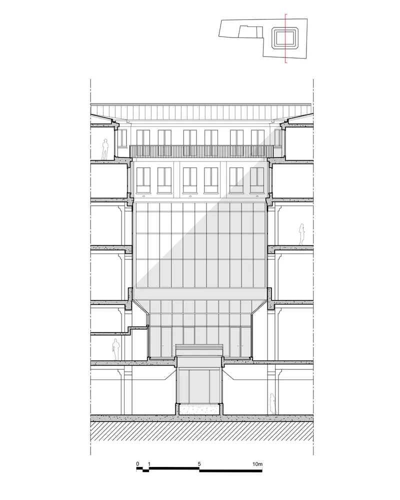 Section drawing showing a central atrium with flanking floor slabs and rooftop structure