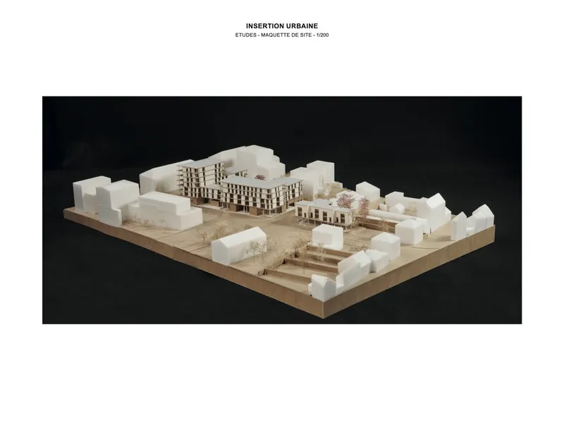 Site model showing buildings with chequered facades surrounded by white context volumes and landscaping