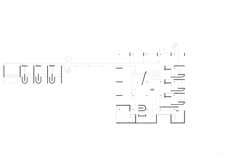Floor plan drawing showing the layout with linear circulation and clustered room groupings
