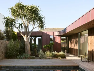Splinter Society Wraps a Seaside Family Home in Curtains, Concrete, and Pink Steel