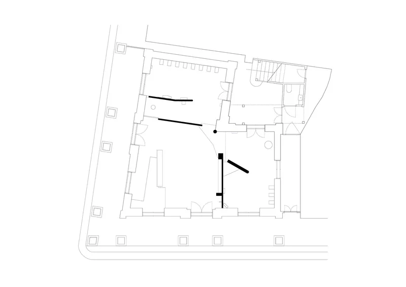 Floor plan drawing of an irregular building with central rooms and adjacent stairwell