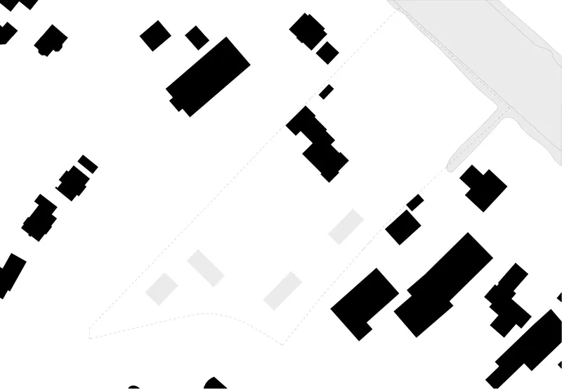 Site plan drawing showing scattered rectangular building footprints in black among existing structures and roads