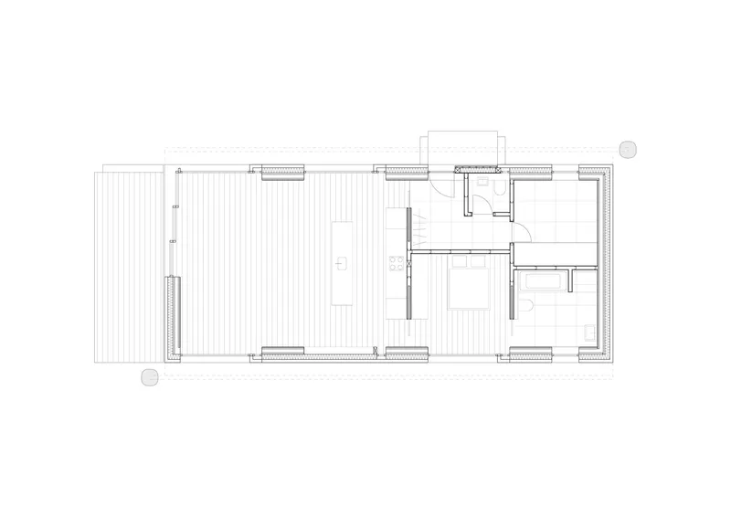 Floor plan drawing showing a unit with open living space, bathroom cluster, and exterior terrace