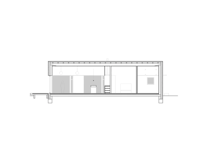 Section drawing revealing the interior layout with exposed roof structure and partition walls