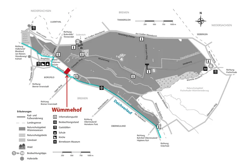 Site plan showing pathways, forested areas, and building locations with legend and scale