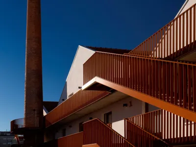 Fragmentos Converts a Porto Factory into a Housing Complex Anchored by Its Own Chimney