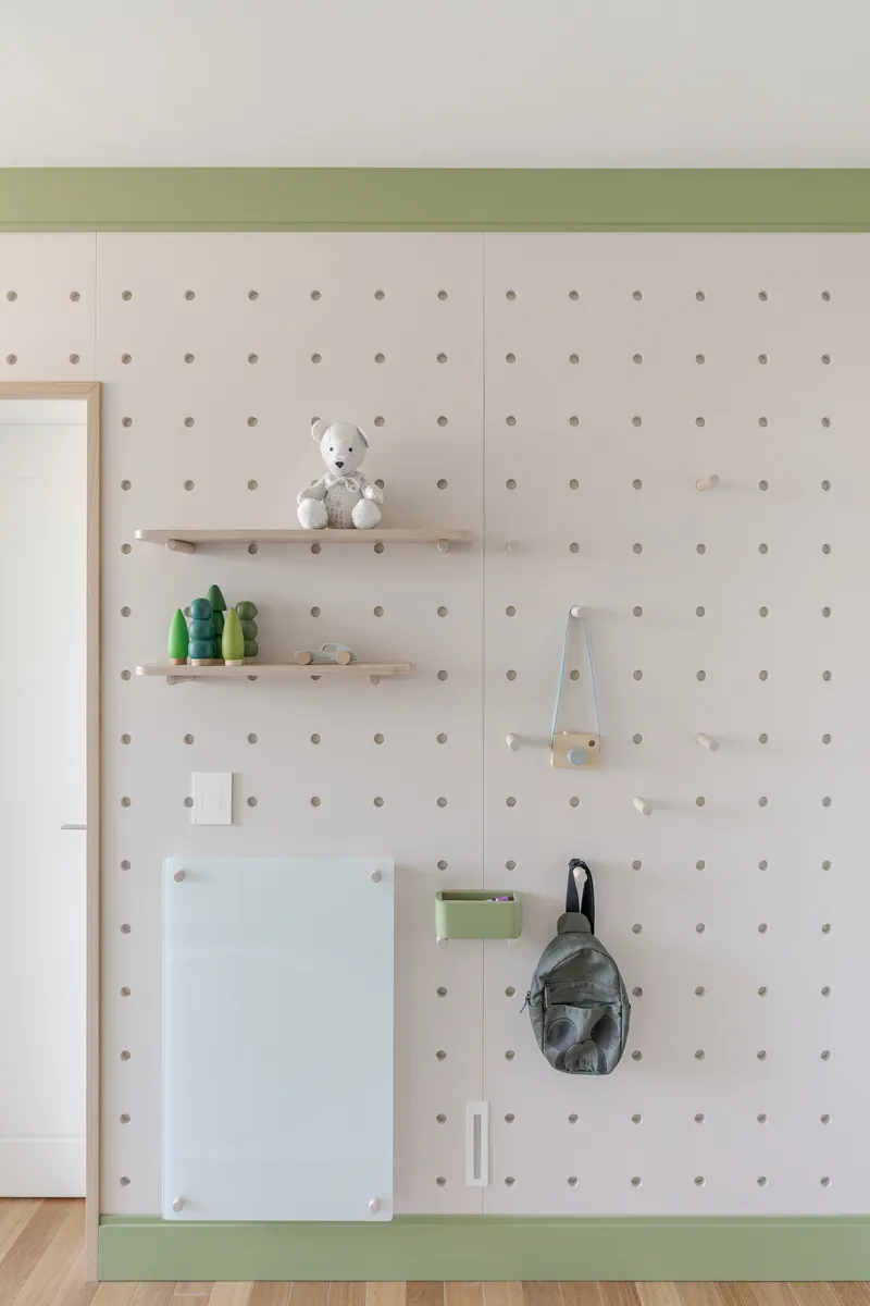 Pegboard wall in white with timber trim, floating shelves, and green baseband detail