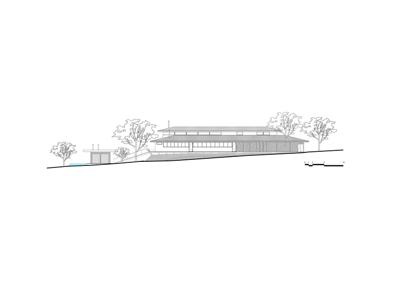 Elevation drawing showing a horizontal structure with flat roofs positioned on a sloping site among trees