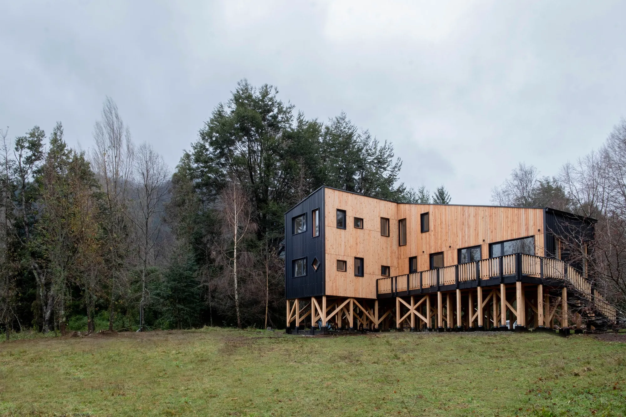 Medio Arquitectura Raises a Prefabricated Timber House Above the Chilean Lakeside Forest
