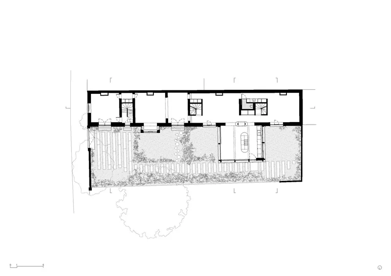 Floor plan drawing showing interior courtyard garden with planted areas alongside enclosed living spaces