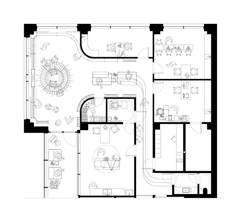 Floor plan drawing showing open workspace with central circular seating area and private meeting rooms