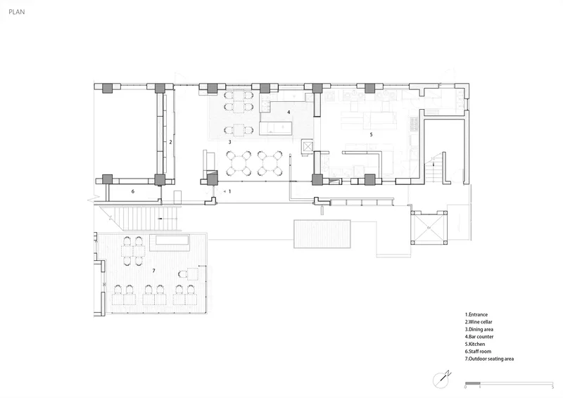 Floor plan drawing showing an L-shaped layout with dining and kitchen zones
