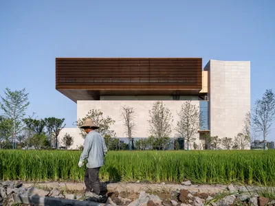 Sens Architects Floats a Bronze Volume Over Rice Fields in Jiaxing's Flower Industry Park