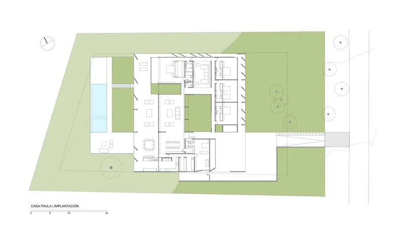 Site plan drawing showing the house with surrounding courtyards, pool, and landscape