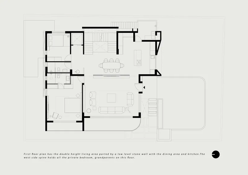 First floor plan with double-height living area divided by a low stone wall separating dining and kitchen