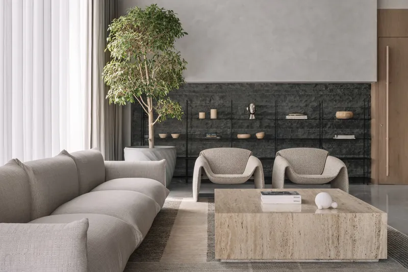 Living area with charcoal stone shelving wall and potted tree beside sheer curtain panels