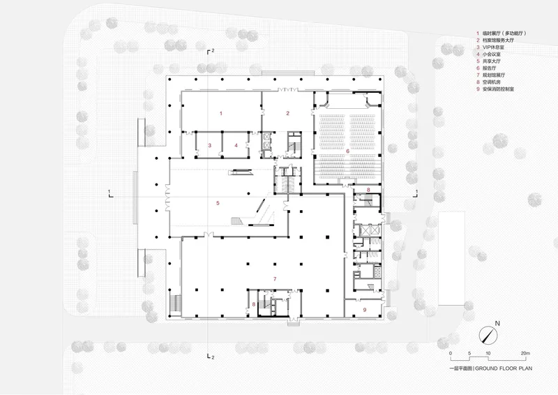 Ground floor plan showing a large auditorium space and open circulation zones with scattered columns