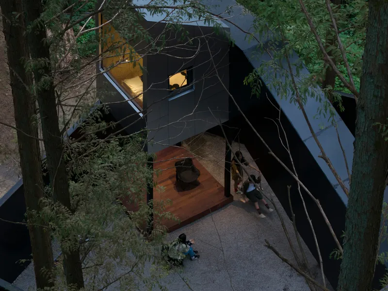 Aerial view of the courtyard with timber deck platform and seated figures framed by dark metal-clad volumes