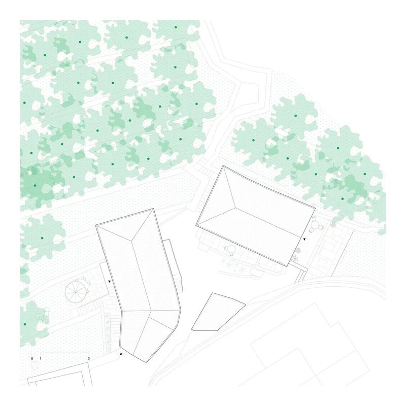 Site plan drawing depicting multiple buildings with pitched roofs set among forested areas