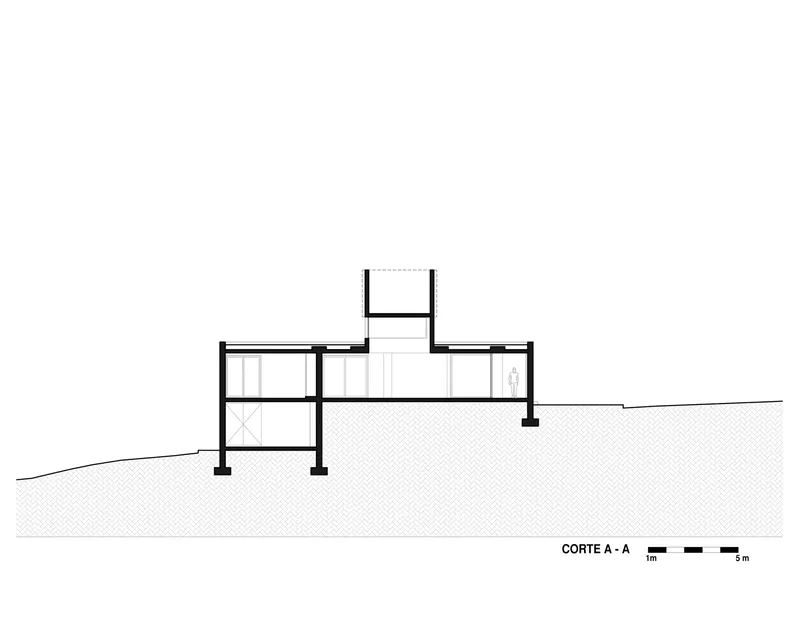 Section drawing showing split-level interior spaces stepping down a sloping site with central chimney element