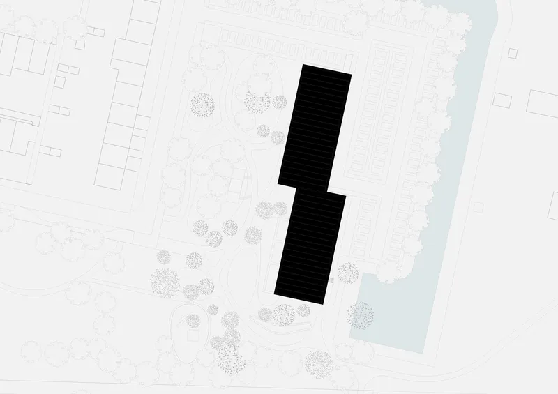 Site plan showing two tower footprints in a landscaped park beside a waterway