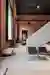 Objekt Architecten Pours a Concrete Disc Through an Aalst Weaving Mill Turned Showroom