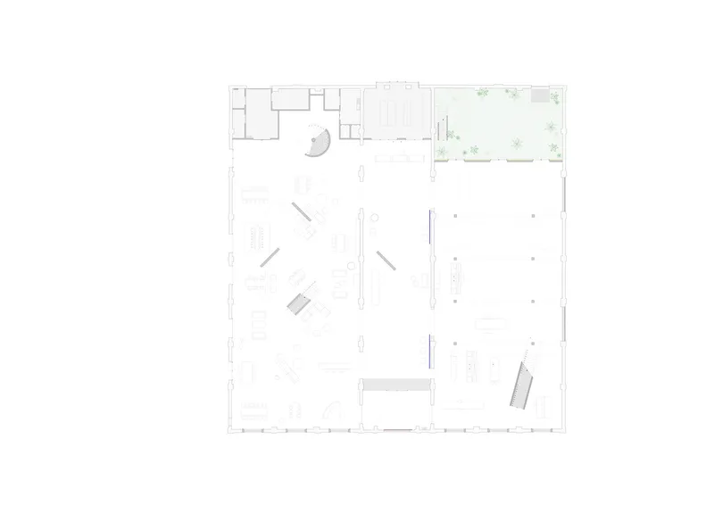 Floor plan drawing showing the open interior with diagonal partitions, courtyard, and perimeter column grid
