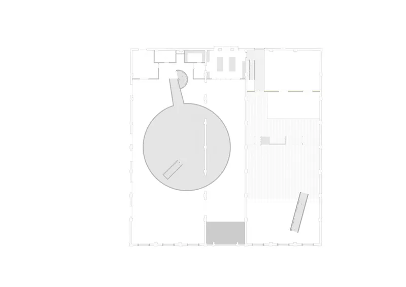 Floor plan drawing showing the circular gallery space and adjacent rectangular hall with regular column spacing