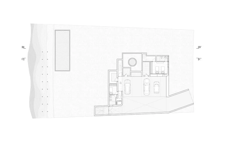 Ground floor plan drawing showing garage, pool, and living spaces with angled property boundary