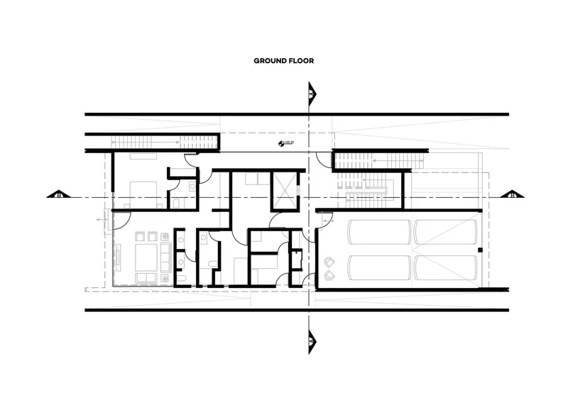 Ground floor plan drawing showing central living areas flanked by two staircases and garage at right