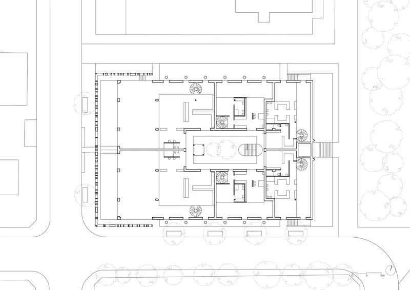 Second floor plan drawing showing smaller residential units clustered around circulation cores