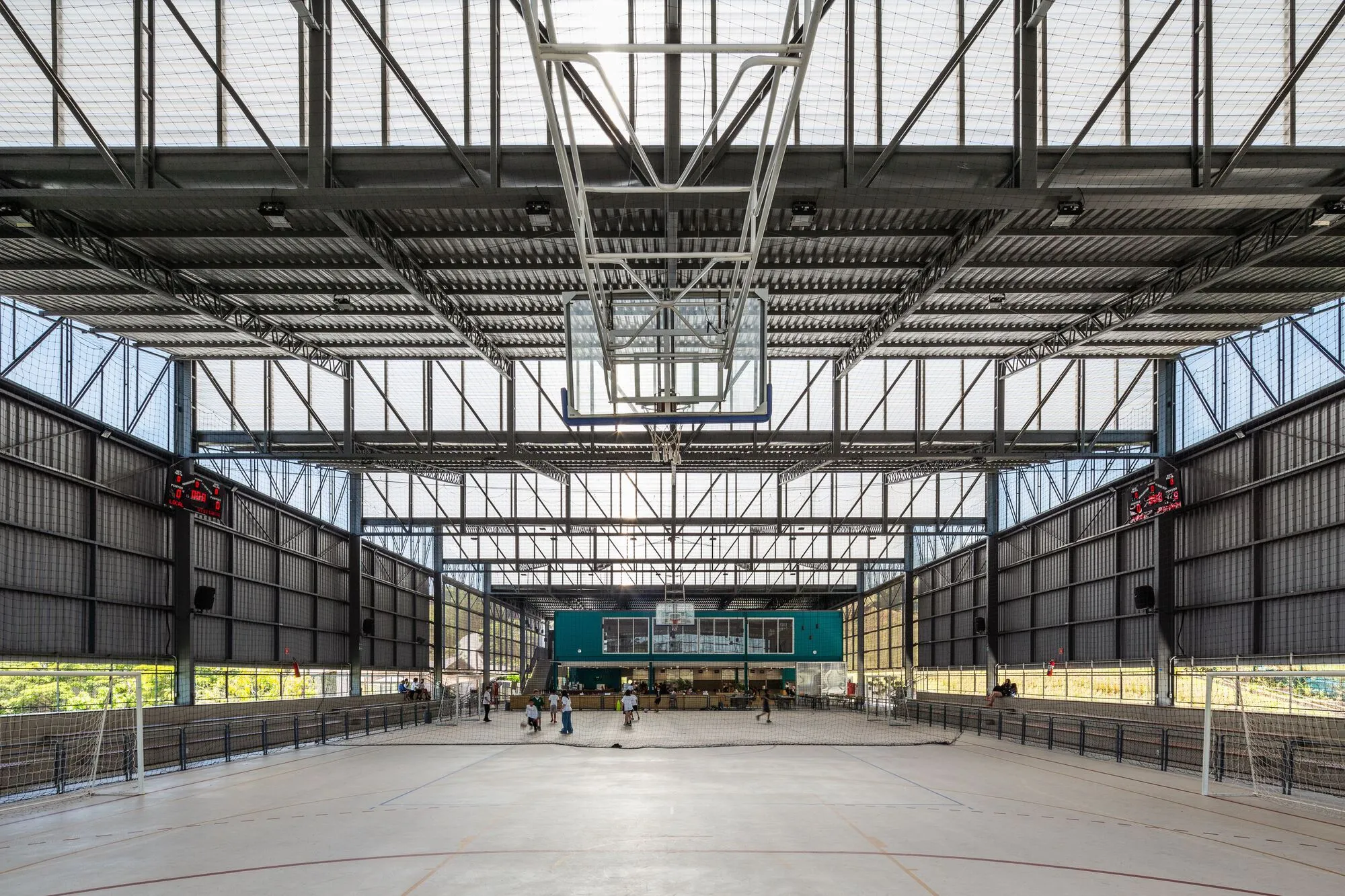 Estúdio Trópico Shelters a School Arena Under 2,100 Square Meters of Sawtooth Roof in São Paulo