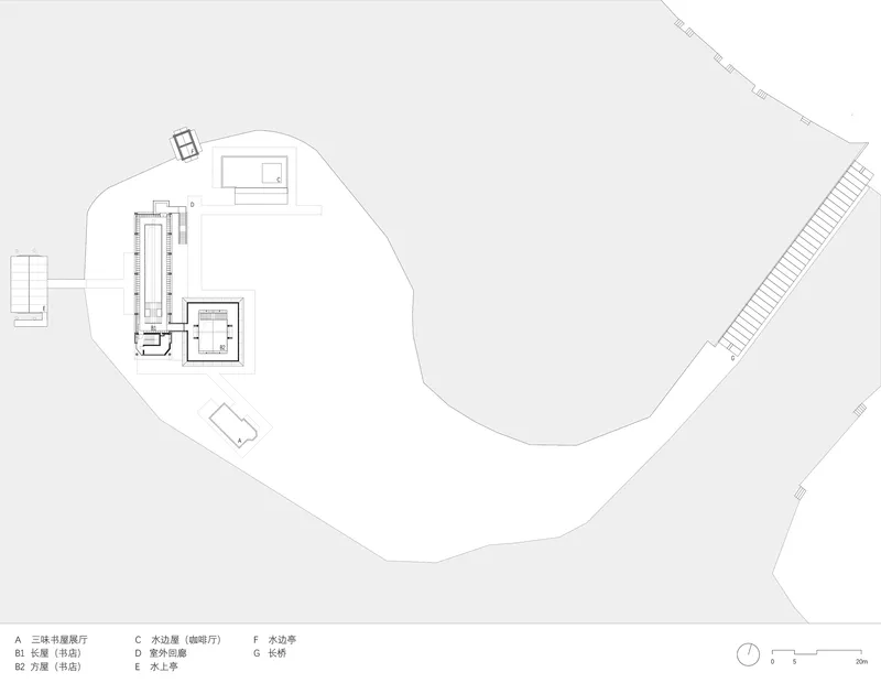 Site plan drawing showing clustered building volumes along a curving boundary with a long access road