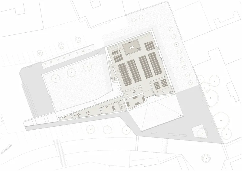 Floor plan drawing showing sanctuary seating arrangement with rows of pews and adjacent circulation spaces