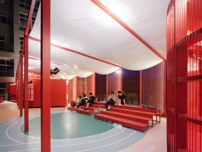 Studio RE + N Turn a Forgotten Rooftop Between Housing Blocks into a Red Steel Commons