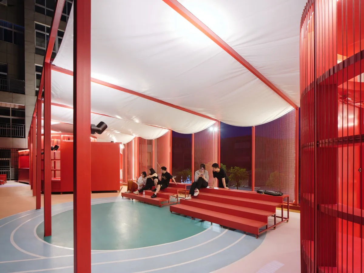 Studio RE + N Turn a Forgotten Rooftop Between Housing Blocks into a Red Steel Commons