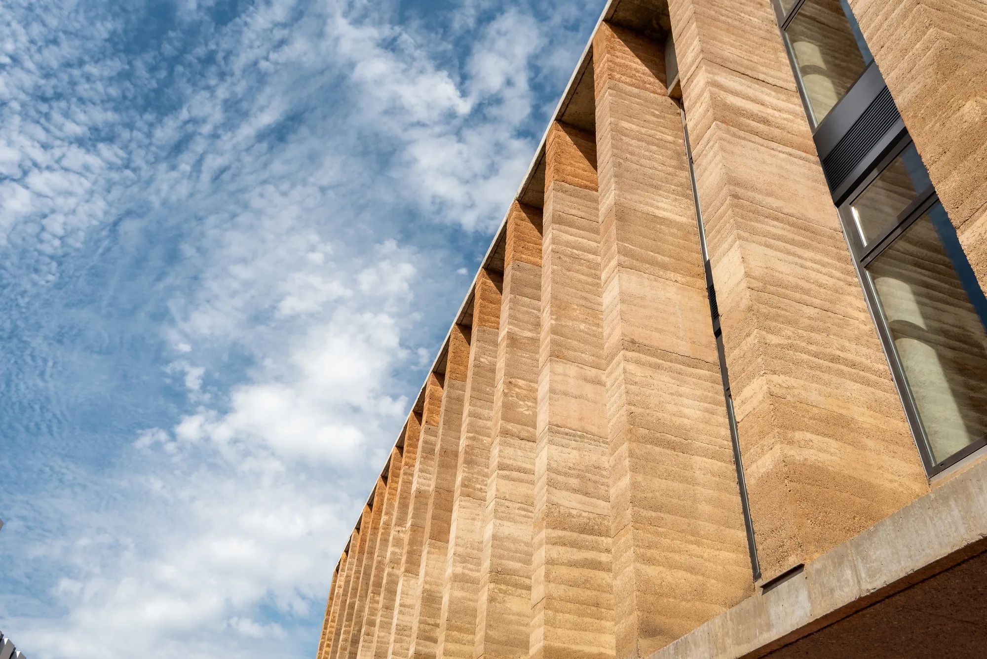 Adjaye Associates Builds Its West African Headquarters from Rammed Earth and a 26-Meter Cantilever